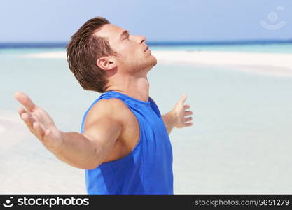 Man Meditating On Beautiful Beach