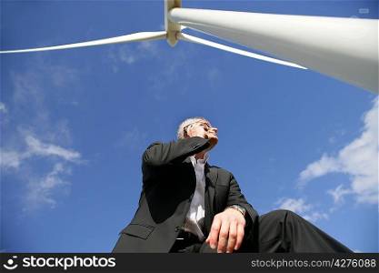 Man near wind turbine