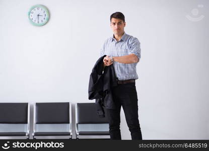 Man nervously impatiently waiting in the lobby