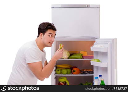 Man next to fridge full of food