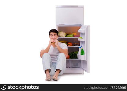 Man next to fridge full of food