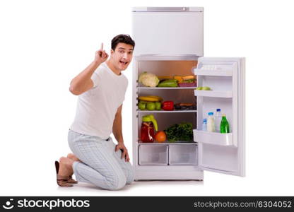 Man next to fridge full of food