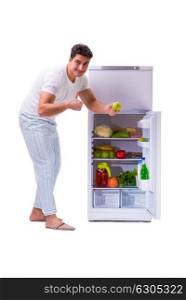 Man next to fridge full of food
