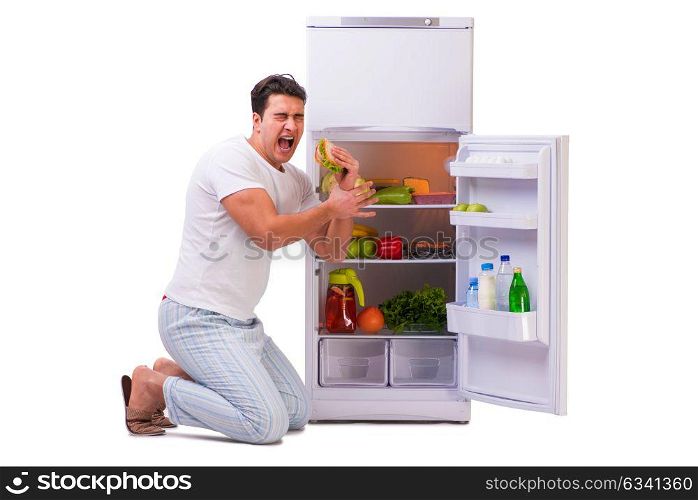 Man next to fridge full of food