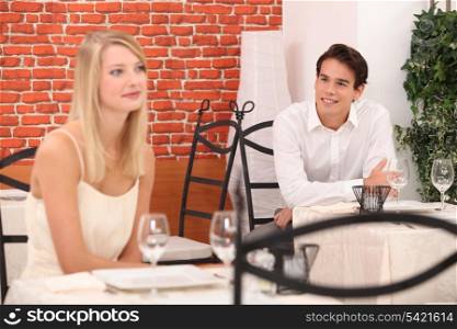 Man observing pretty lady in a restaurant