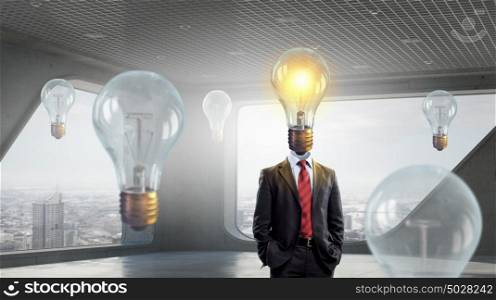 Man of bright head. Businessman with light bulb instead of head presenting idea concept