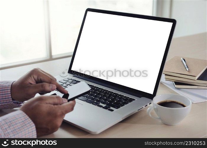 man of business man hand working on laptop computer blank white screen laptop  on vintage wooden