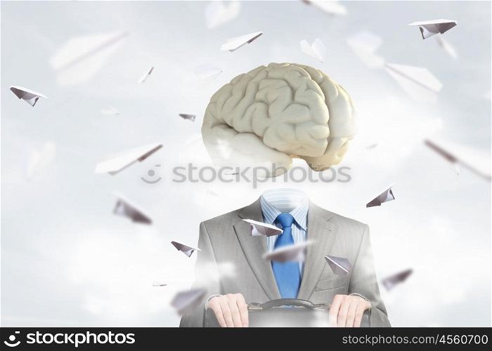 Man of great mind. Businessman with suitcase and brain instead of head