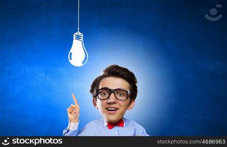 Man of great mind. Idea concept with businessman with big head and light bulb hanging above