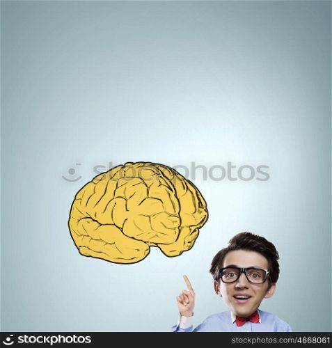 Man of great mind. Idea concept with businessman with big head pointing at big brain
