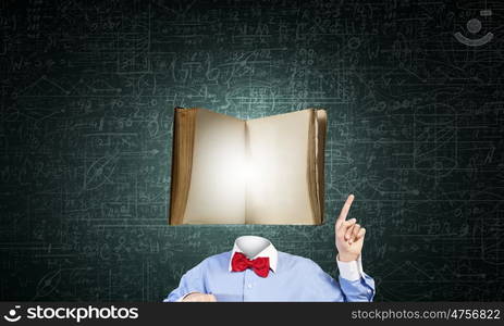 Man of great mind. Unrecognizable man with book instead of his head