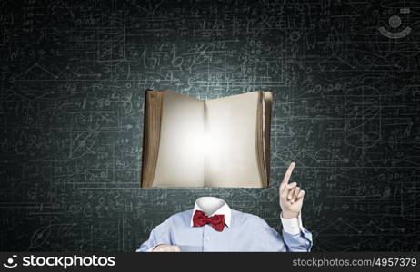 Man of great mind. Unrecognizable man with book instead of his head