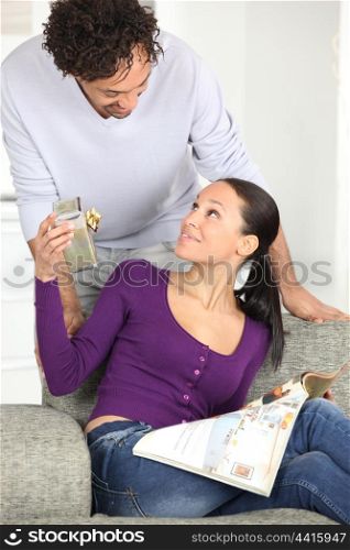Man offering gift to his wife