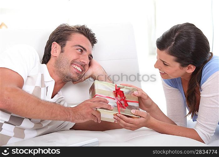 Man offering gift to woman