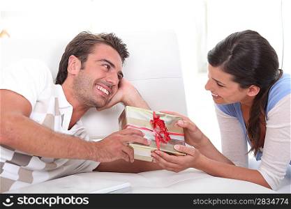 Man offering gift to woman