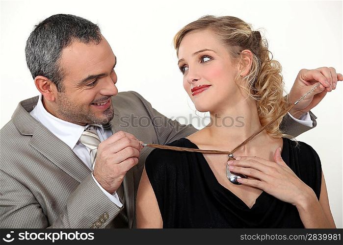 Man offering his wife a gift