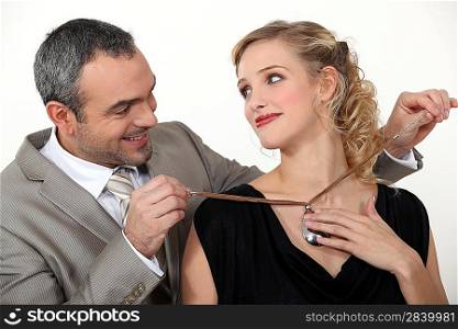 Man offering his wife a gift