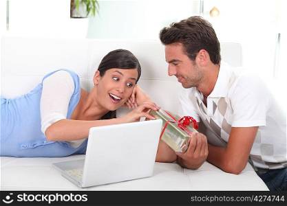 Man offering present to wife