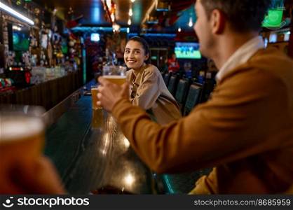 Man offering young pretty woman to clink glasses. Selective focus on smiling attractive girl at bar counter. Man offering pretty woman to clink glasses