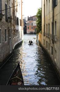 Man on a boat in Venice. Pass thru the channel