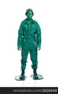 Man on a green toy soldier costume isolated on white background.