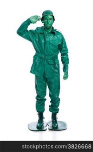Man on a green toy soldier costume saluting isolated on white background.