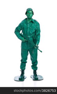 Man on a green toy soldier costume with riffle isolated on white background.