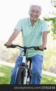 Man on bike outdoors smiling