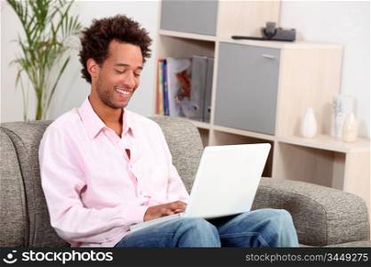 Man on couch with computer