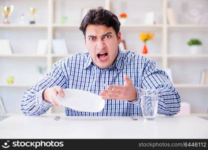 Man on diet waiting for food in restaurant