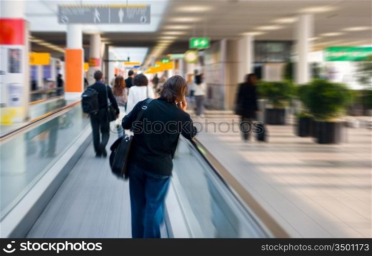 man on escalator is going to his gate
