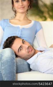 Man on his girlfriend&rsquo;s lap