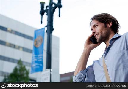 Man on his way to work, using cellphone