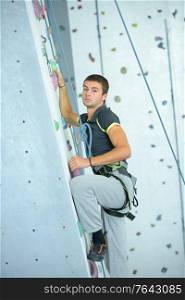 Man on indoor climbing wall