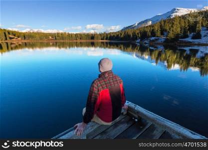 Man on mountains lake