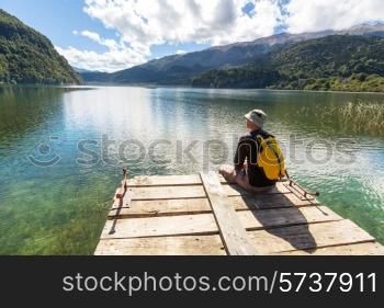 Man on mountains lake