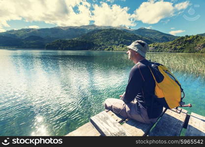 Man on mountains lake