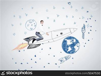 Man on rocket. Young businessman,an flying in sky on drawn rocket