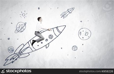 Man on rocket. Young businessman flying in sky on drawn rocket