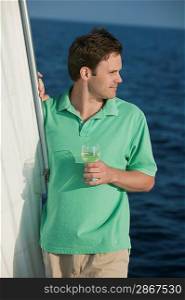 Man on Sailboat with Glass of Wine