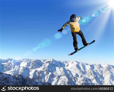 Man on snowboard jumping in sky. Summer vacation. Snowboarder in jump