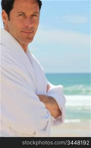 Man on the beach in bath robes