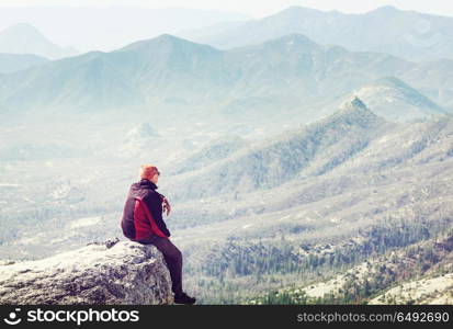 Man on the cliff. Man on the sheer cliff