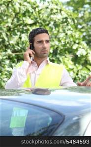 Man on the phone after a car breakdown