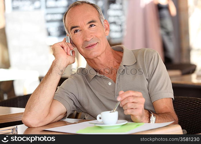 Man on the phone having coffee