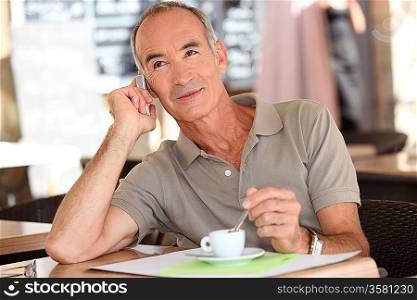 Man on the phone having coffee
