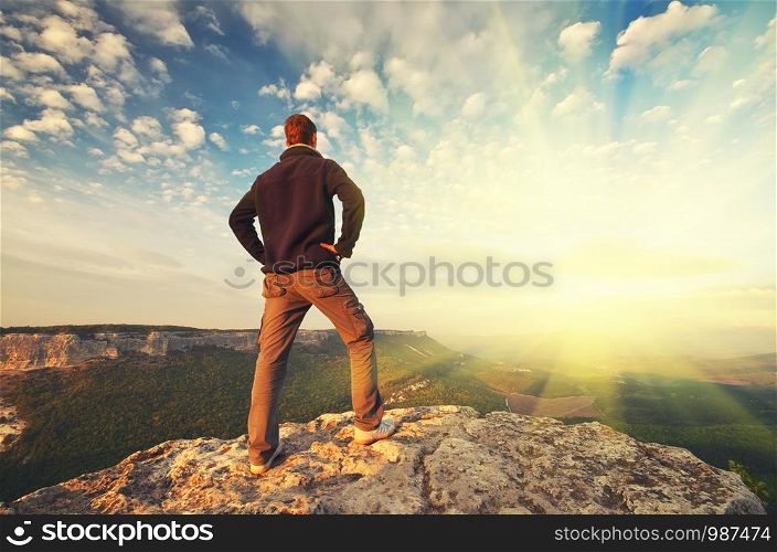 Man on top of mountain. Conceptual scene.