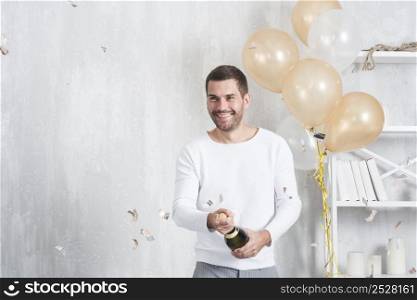 man opening bottle champagne