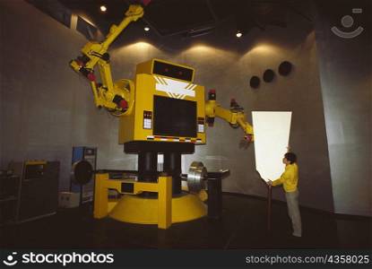 Man operating a robot, Tokyo Prefecture, Japan
