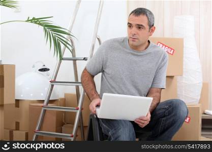 Man organizing logistics of house move